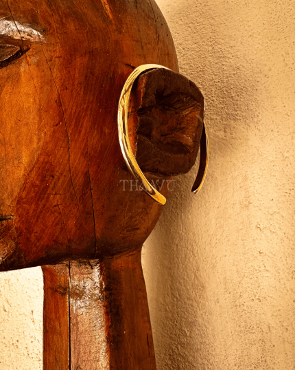 Close-up of adjustable design on Mbangili Ensemble brass bracelet by Thaavu.